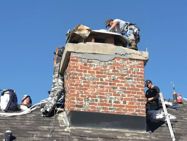 Cape Coral Chimney Sweep installing a custom chimney crown in Cape Coral, FL