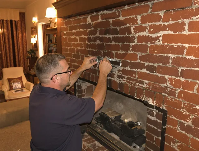 Cape Coral Chimney Sweep expert fixing a fireplace in Cape Coral, FL